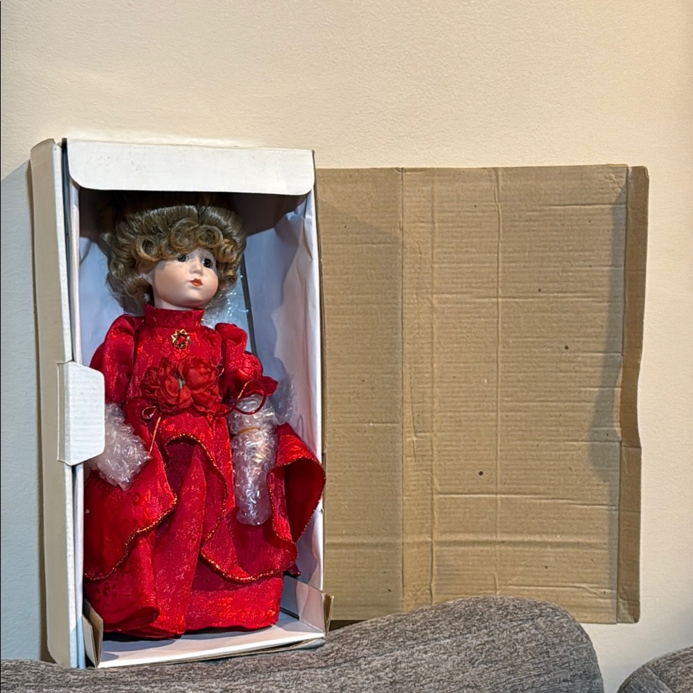 Elegant Red Doll with Curly Hair